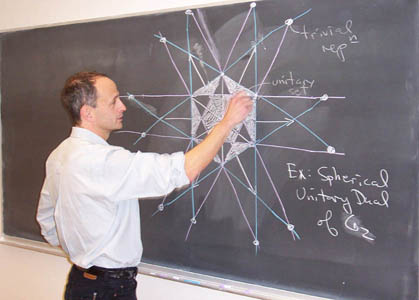 Jeffrey Adams drawing a diagram on the blackboard
